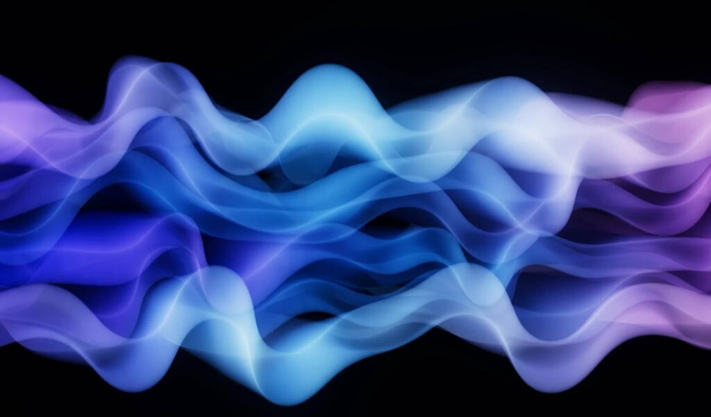 Example of Mermaidcore colors in purple, blue and pink gradients in a wavy shape across a black background
