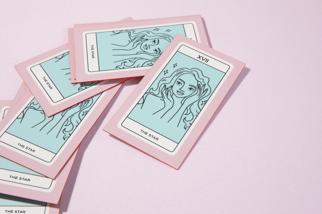 Pink and blue business cards designed like tarot cards
