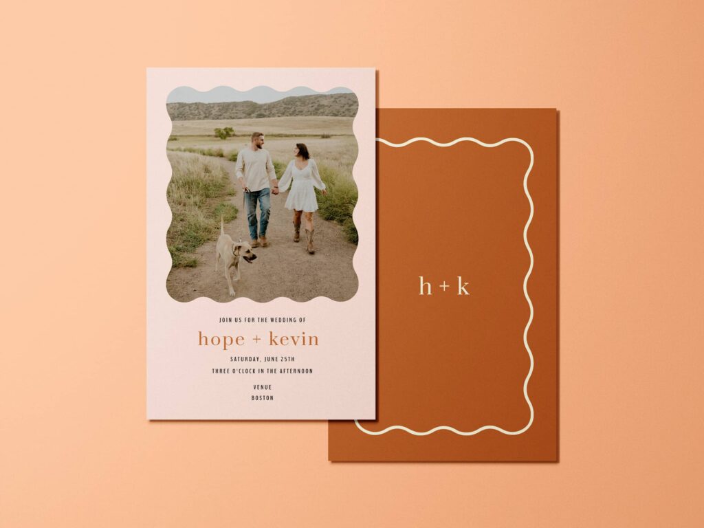 Orange wedding invitation with playful wavy design elements