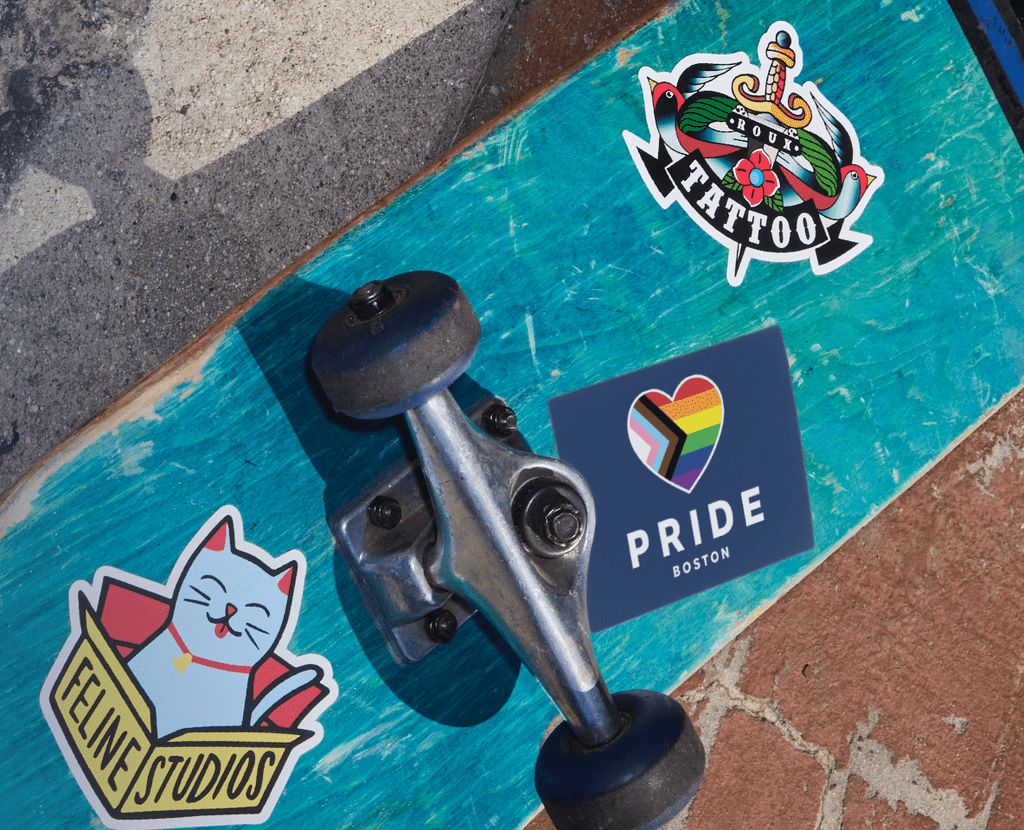 Permanent adhesive stickers applied to the bottom of a skateboard