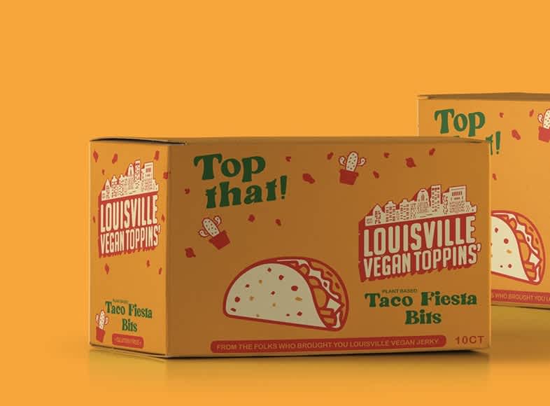 Bright yellow retail box packaging for Louisville Vegan Toppins&rsquo; Taco Fiesta Bits featuring playful taco illustrations, retro-inspired typography and red and green branding against a mustard yellow background.