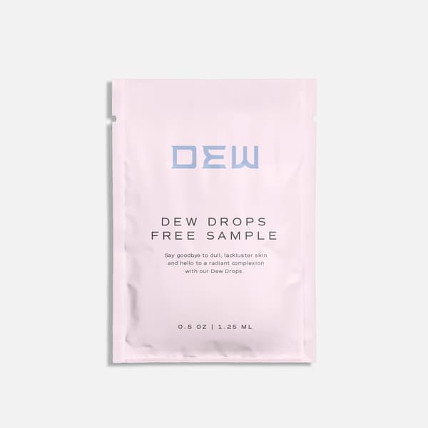 Minimal pink sample sachet packaging labeled "Dew Drops Free Sample" with clean branding and soft pastel design.