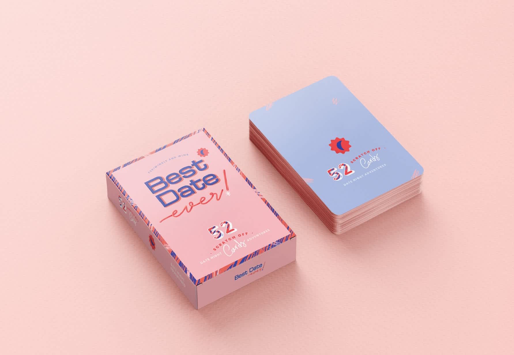 Pink and blue &ldquo;Best Date Ever&rdquo; scratch-off date night card game packaging displayed beside a stack of matching cards on a soft pink background.