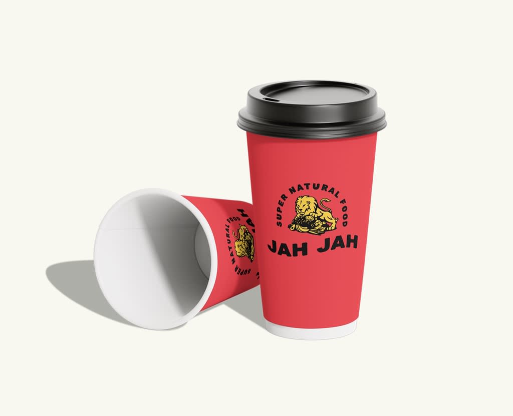 Branded red takeaway coffee cups with fitted lids, designed for hot beverages and on-the-go use.