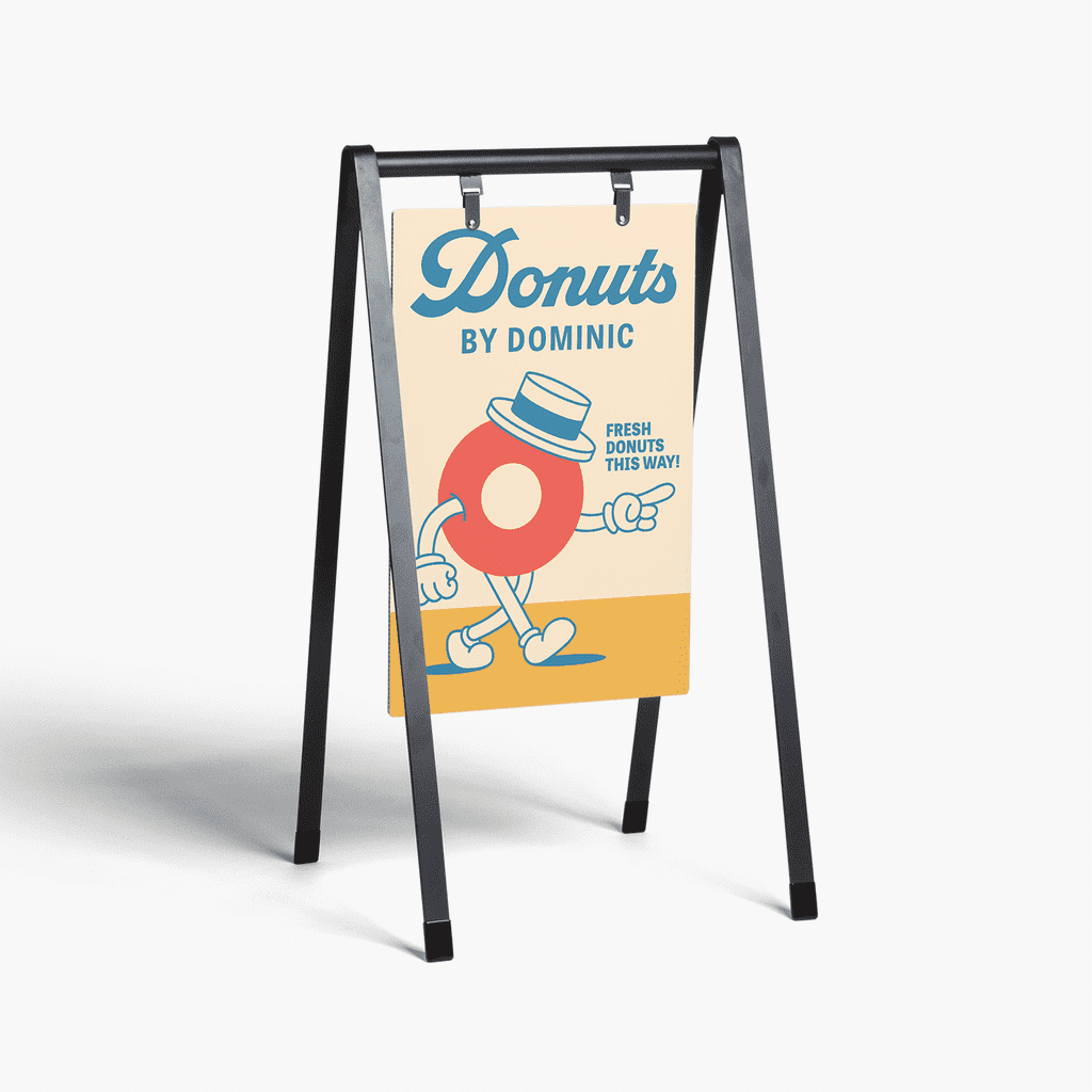 Sidewalk sign for a donut shop using bold retro-inspired display typography to create a distinctive, highly visible brand presence.