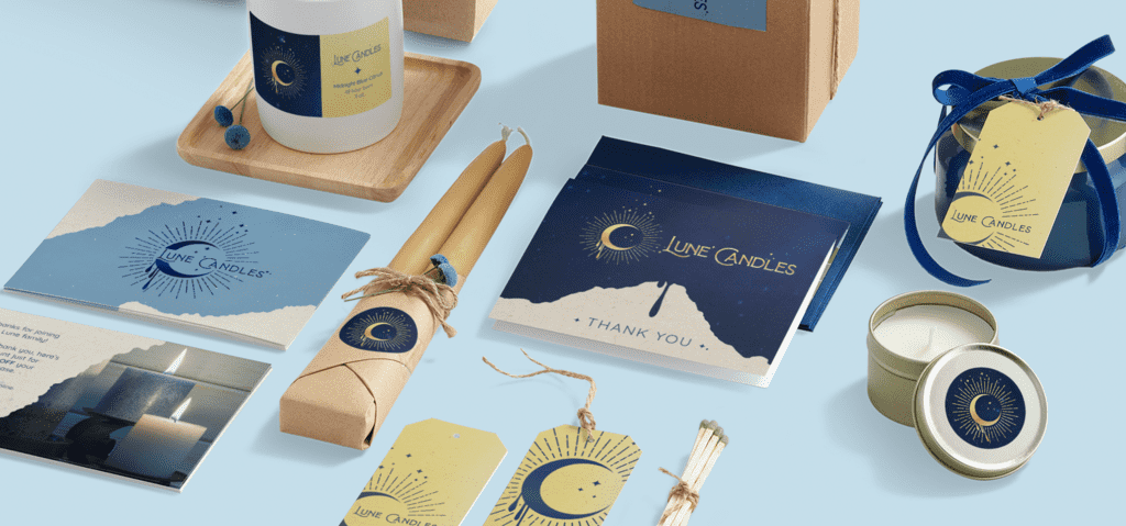 Print marketing materials for a candle company featuring consistent serif typography applied across packaging, product labels, tags, inserts and printed collateral.