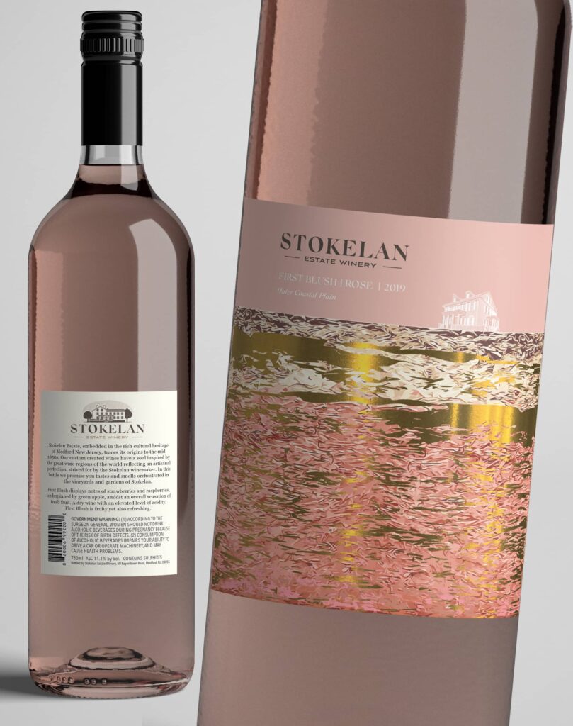 Luxury rosé wine bottle with an elegant blush-toned label featuring refined serif typography, metallic foil landscape artwork and a premium minimalist design aesthetic.