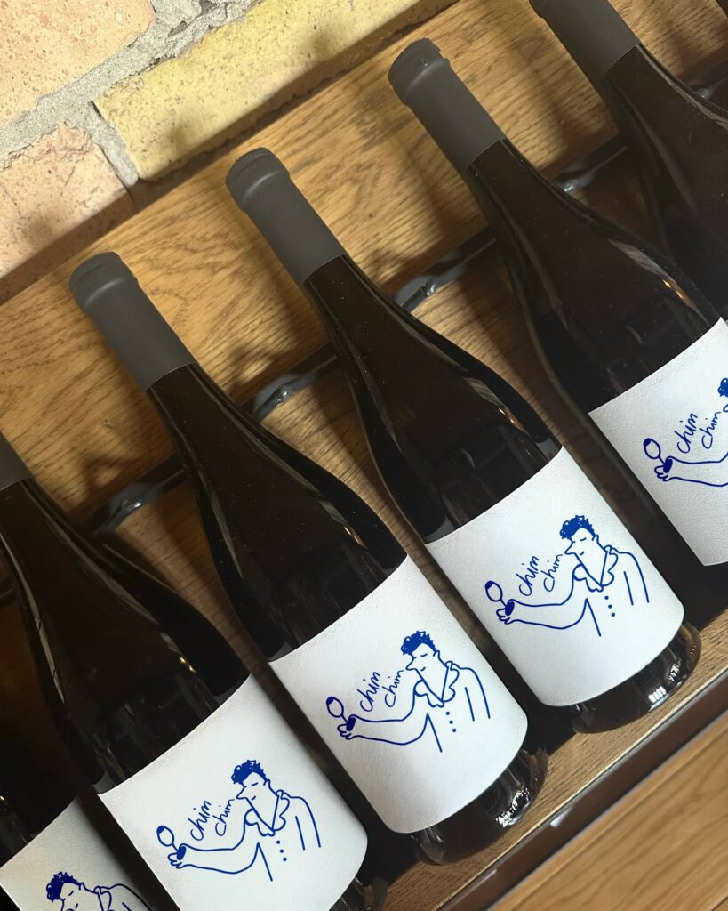 Minimal wine bottle labels featuring simple hand-drawn illustrations, clean white backgrounds and playful line art with a modern human-centered design style.
