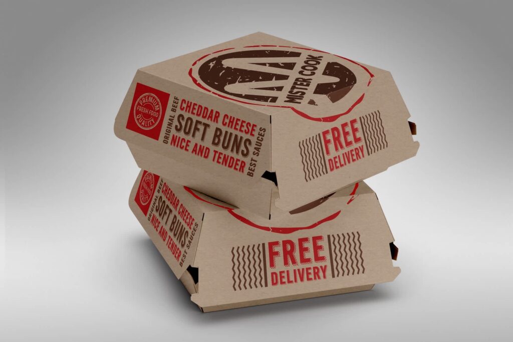 Stacked kraft paper takeaway boxes with red printed branding and &ldquo;free delivery&rdquo; text, designed for burgers or hot food packaging.