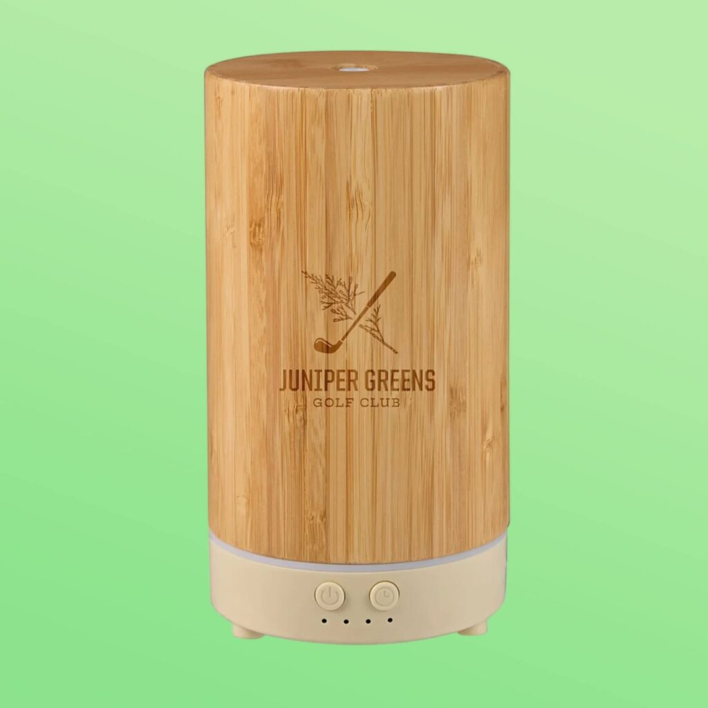 Bamboo aromatherapy diffuser with a burnished golf club and juniper business logo.