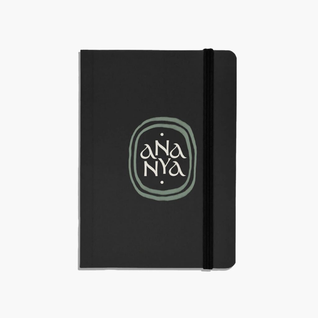 A custom leather journal with the brand logo in the front