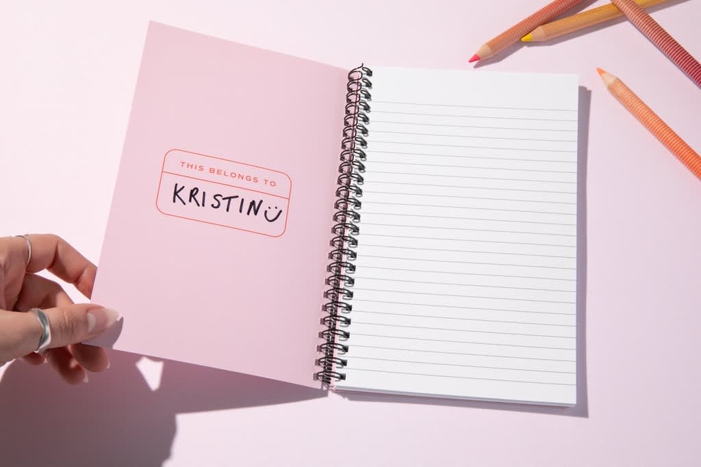 Custom spiral bound notepad with the recipient’s name inside.