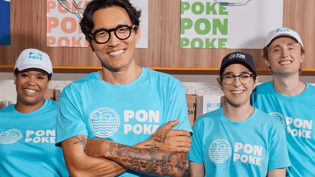 Food industry poke small business employees wearing blue custom work uniforms