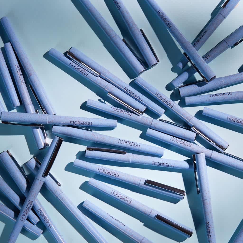 Personalized pens with the brand logo.