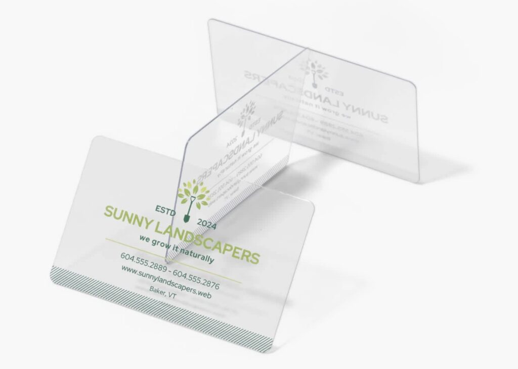 Clear plastic business cards for a landscaping company with green branding and transparent backgrounds.
