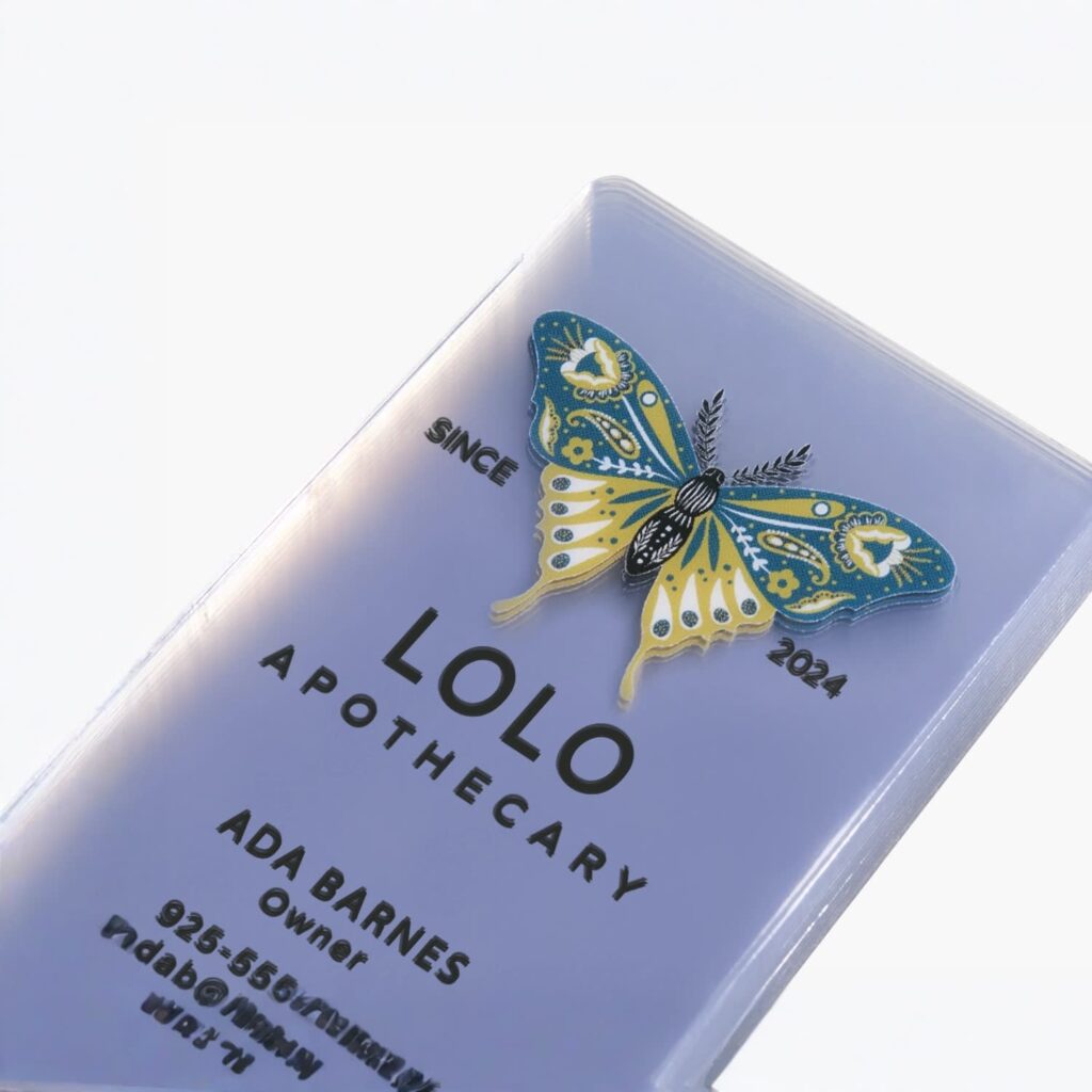 Frosted plastic business card with bold black typography, fine lettering and an intricate illustrated butterfly design.