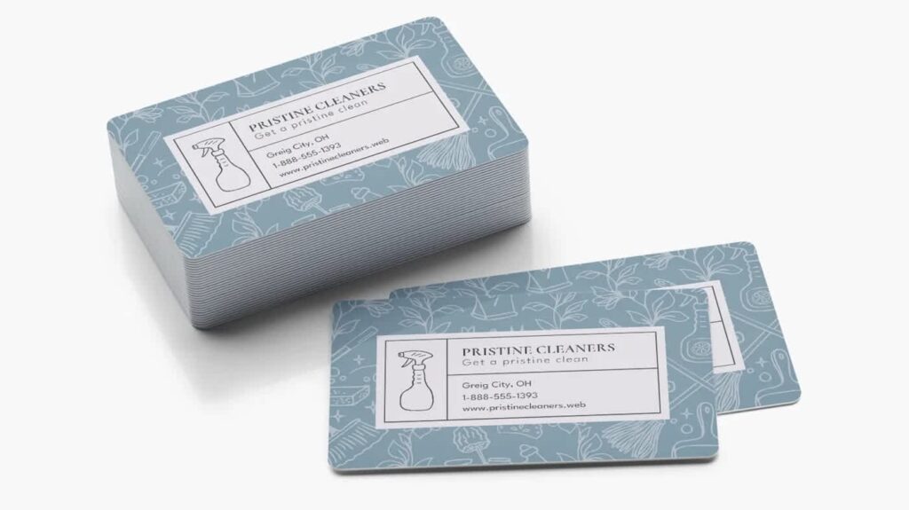 Waterproof business cards for a cleaning company with a blue illustrated pattern and spray bottle logo.