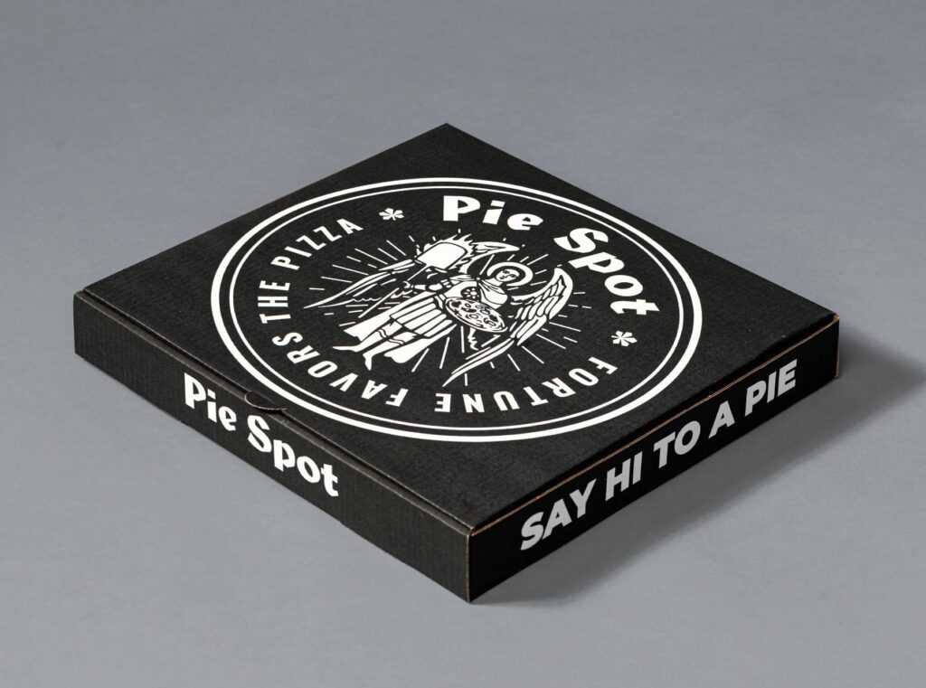 Custom black Pie Spot pizza box featuring a punk rock-inspired emblem based on Kyiv's coat of arms, with Archangel Michael holding a pizza peel and pizza shield, surrounded by chestnut symbols.