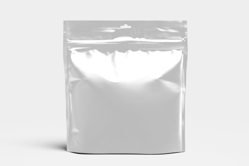 Silver metallized stand-up pouch with a resealable zipper, hanging hole and reflective finish against a light gray background.