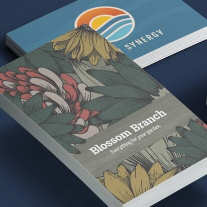 Stack of business cards in various styles featuring serif, sans-serif and script fonts with diverse layouts and textures