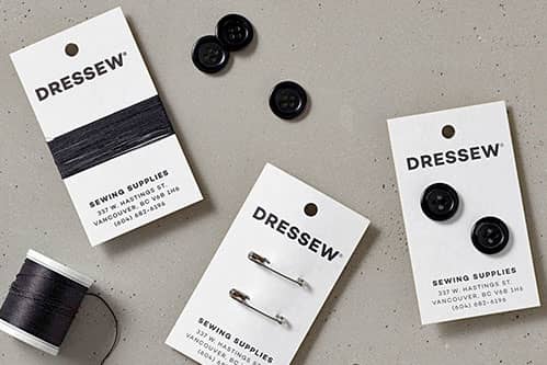 Business card for a sewing business that included thread and two buttons