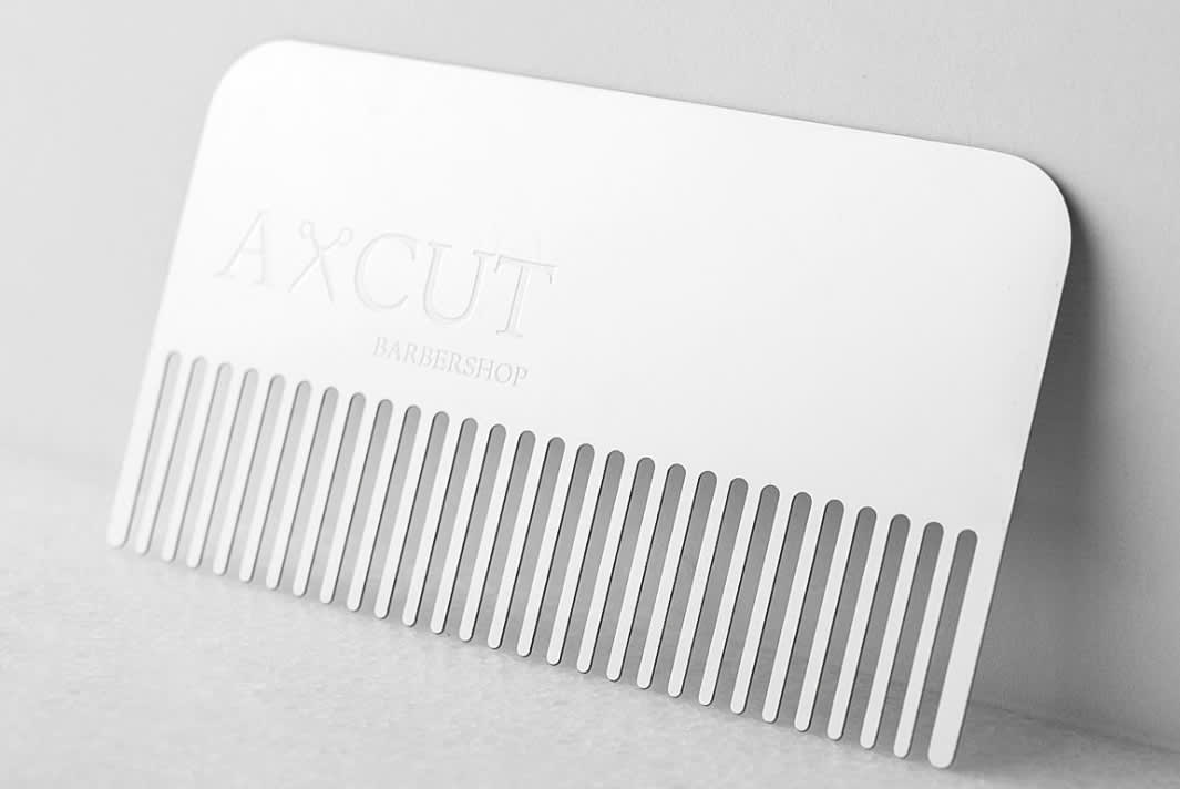 Uniquely shaped business card in the shape of a comb