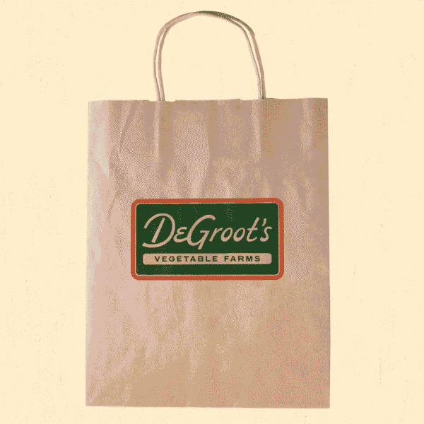 Vintage-inspired logo on paper bag packaging for grocery shop&mdash;an example of the Alt-History packaging trend 2026