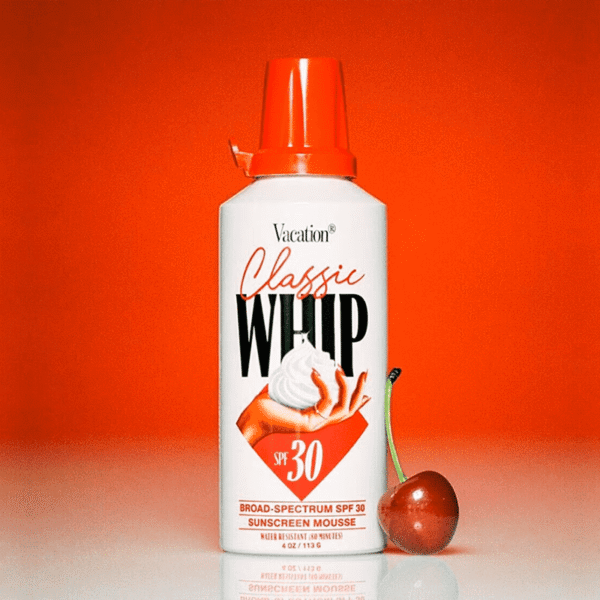 Vacation Classic Whip sunscreen mousse SPF 30 packaged like a retro whipped cream can, with bold vintage lettering and playful design&mdash;an example of the Alt-History packaging trend 2026