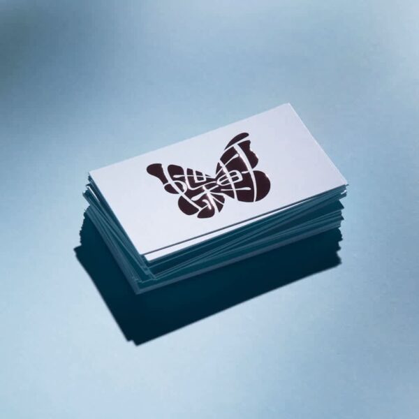 A business card with a butterfly logo, branding design examples
