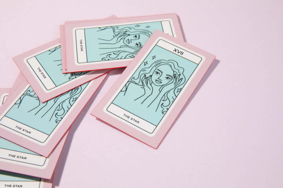 A pink and blue business card layout inspired by tarot cards, branding design examples