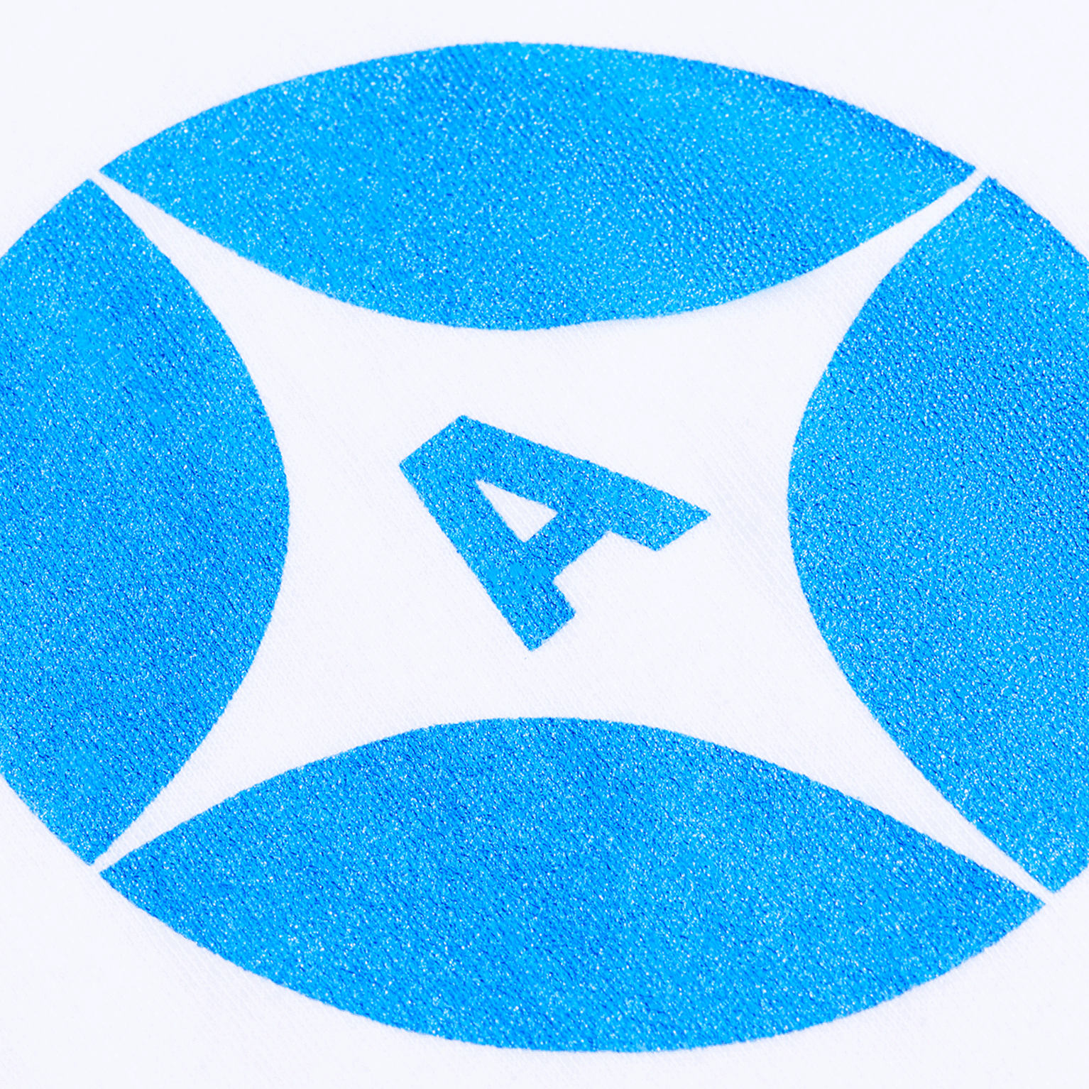 A close-up photo of a monochrome blue brand logo printed on fabric using screen printing method