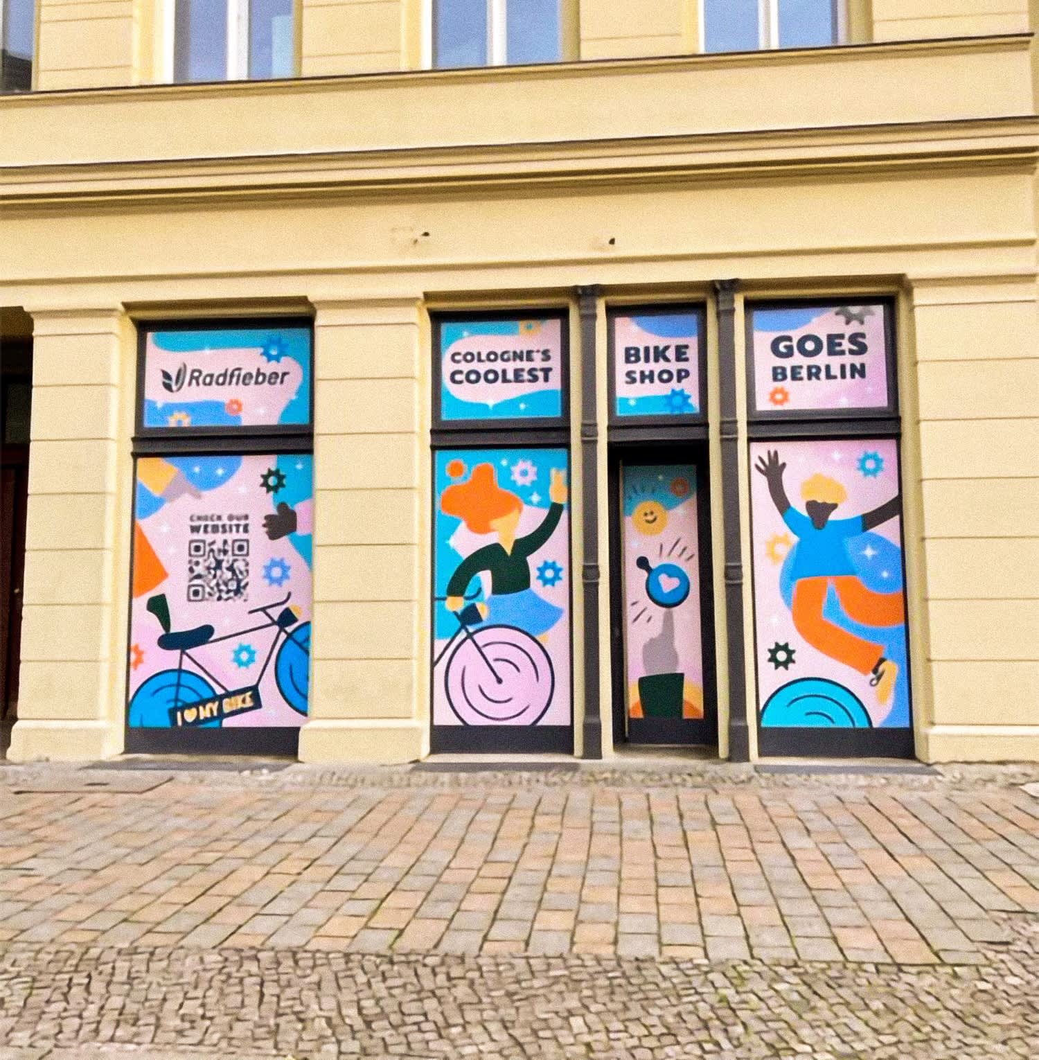 outdoor window and door dressings in pink, with flat design images of people and bikes