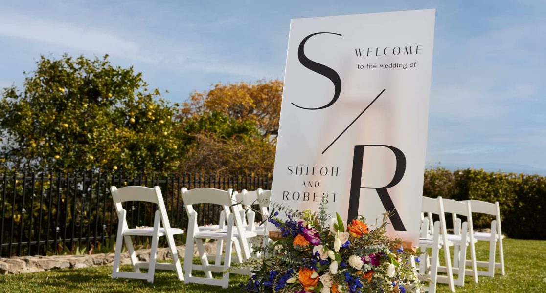 A wedding welcome sign with a monogram design