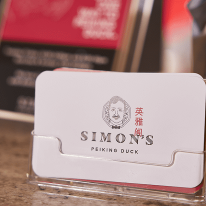 A stack of unique business cards in a restaurant