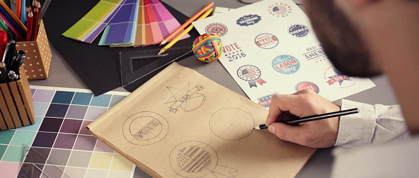 Someone sketching a logo