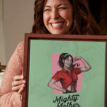 women holding print that says Mighty Mother