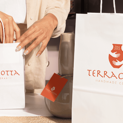 "Terracotta" brand logo printed in different sizes across packaging accessories