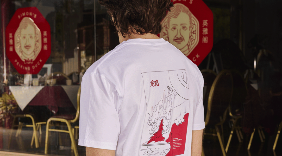 back-facing monochrome t shirt print in red and white, with matching signs in background