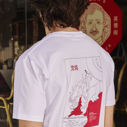 back-facing monochrome t shirt print in red and white, with matching signs in background