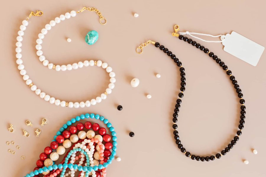 Jewelry making flatlay with semi-precious stone beads and tools. Handmade jewelry, small business, hobby concept