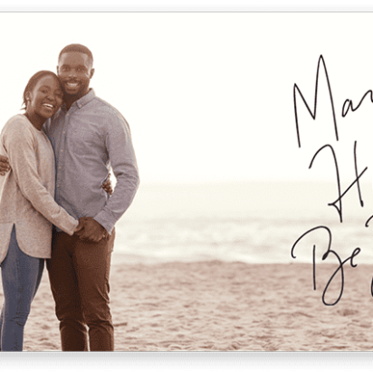 personalized holiday card from couple on the beach
