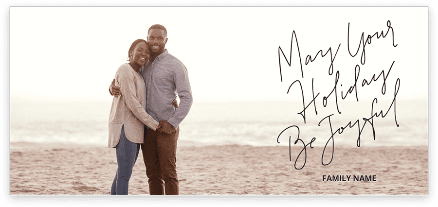 personalized holiday card from couple on the beach