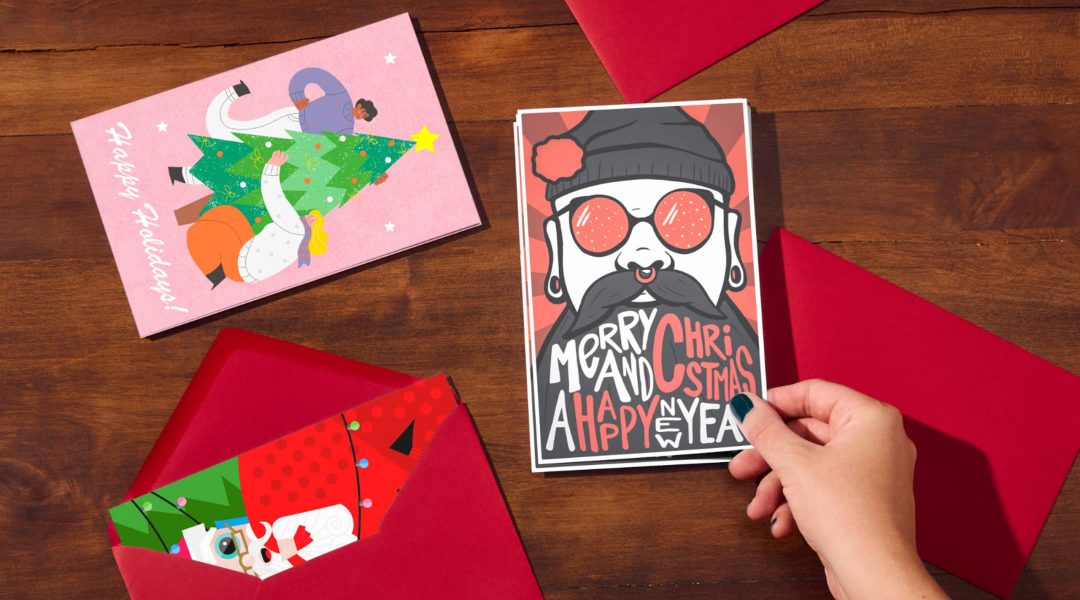 hand picks up Christmas card