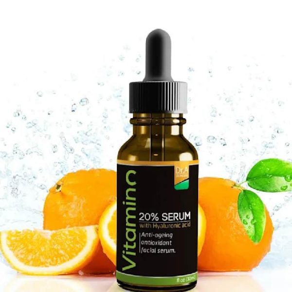 Black product label with orange, white and green details for a vitamin brand