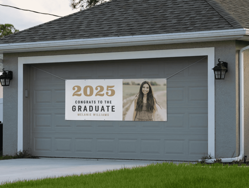 graduation banner hanging over a garage