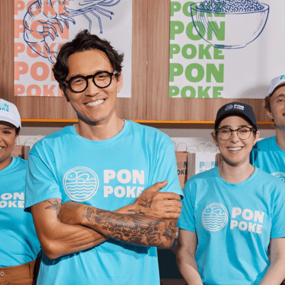 Poke business employees wearing branded T-shirts.