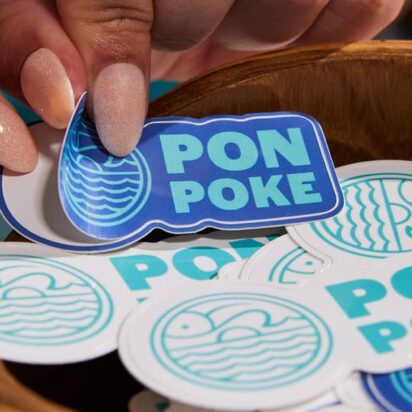 A bowl of stickers with a stunning logo design