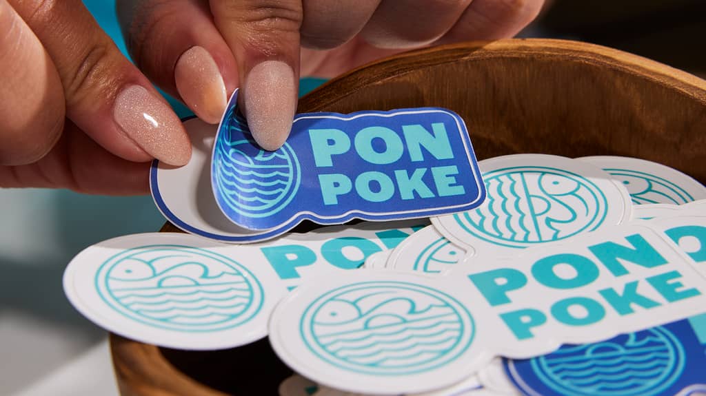 A bowl of stickers with a stunning logo design