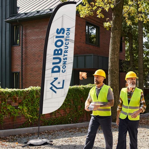 Construction company evokes trust and reliability with blue logo printed on flag sign