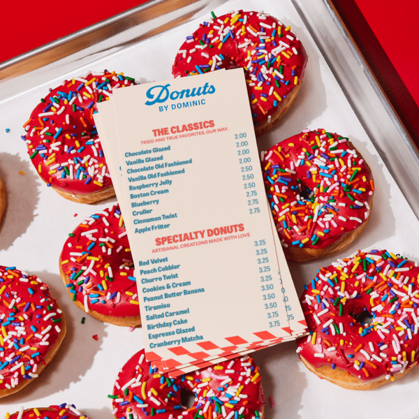 Blue logo with red accent printed on a menu